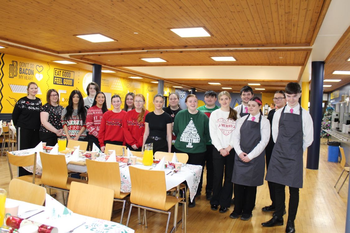 Lecturers Sheena Hunt and Clare Gillen with students from the Level 2 Traineeship Hospitality & Tourism Team Member and Level 3 BTEC Diploma in Hospitality with Events 